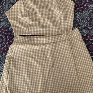 Two-piece set. Top and shorts. Tan and cream colored.